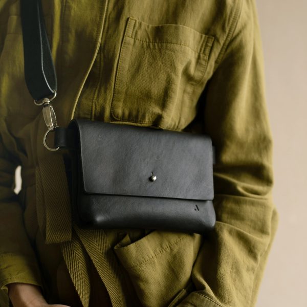 acorn leather crossbody bag - black main - Shopfox